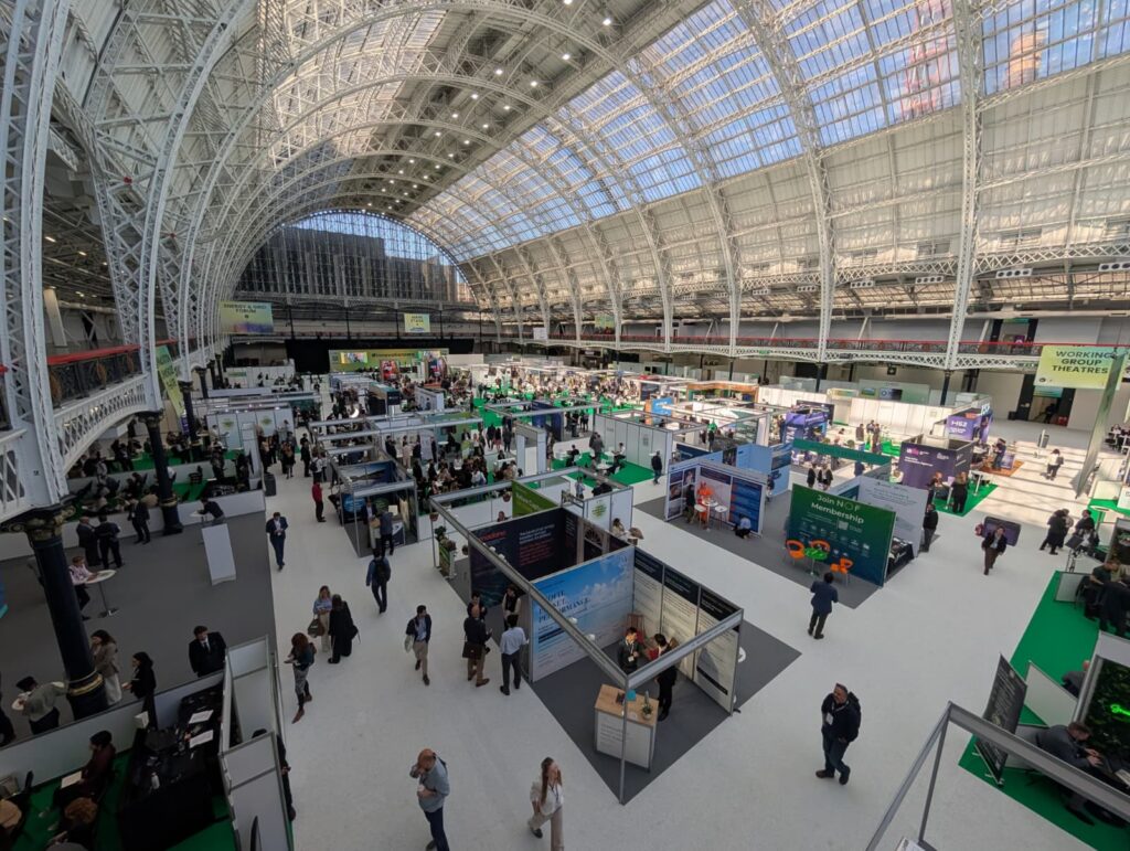Busy UK exhibition hall floor showing multiple stands — choosing the right trade shows