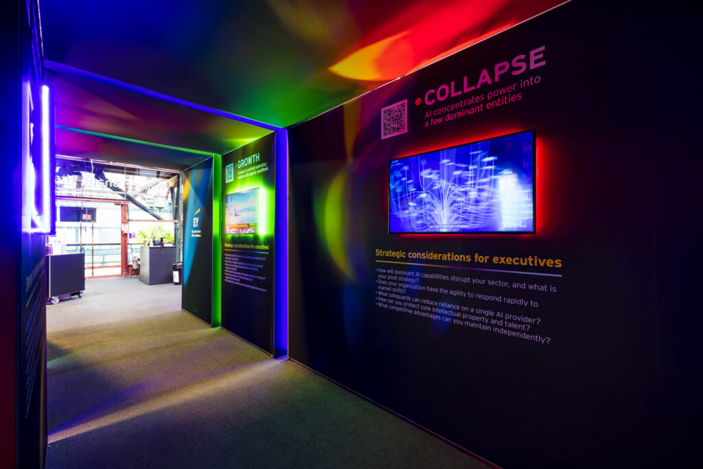 Immersive exhibition stand walkway with neon lighting and a wall-mounted LED screen, showing how integrated technology enhances stand atmosphere.